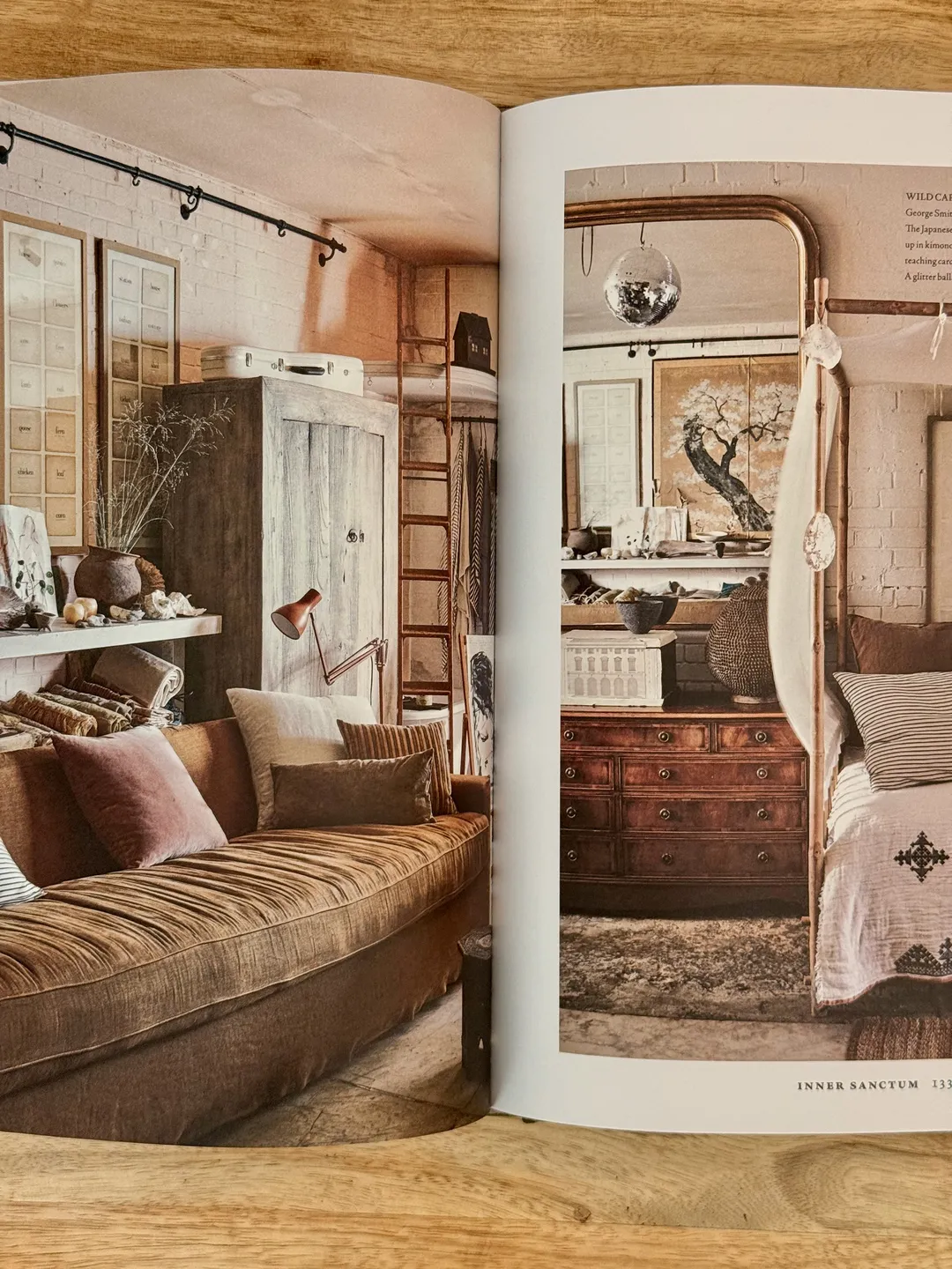 Daybed in a room of salvaged wood, old cabinets and a mirrored doorway
