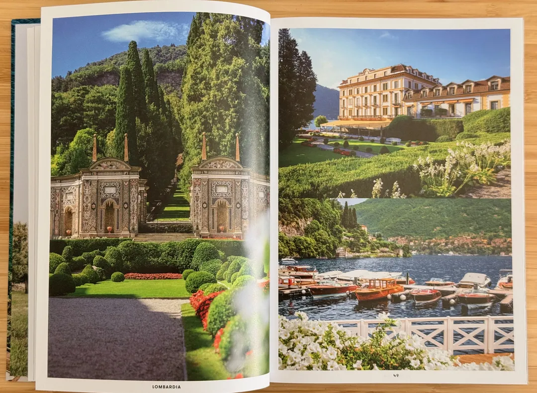 Lakeside villa gardens with cypress trees and a grand hotel above the water