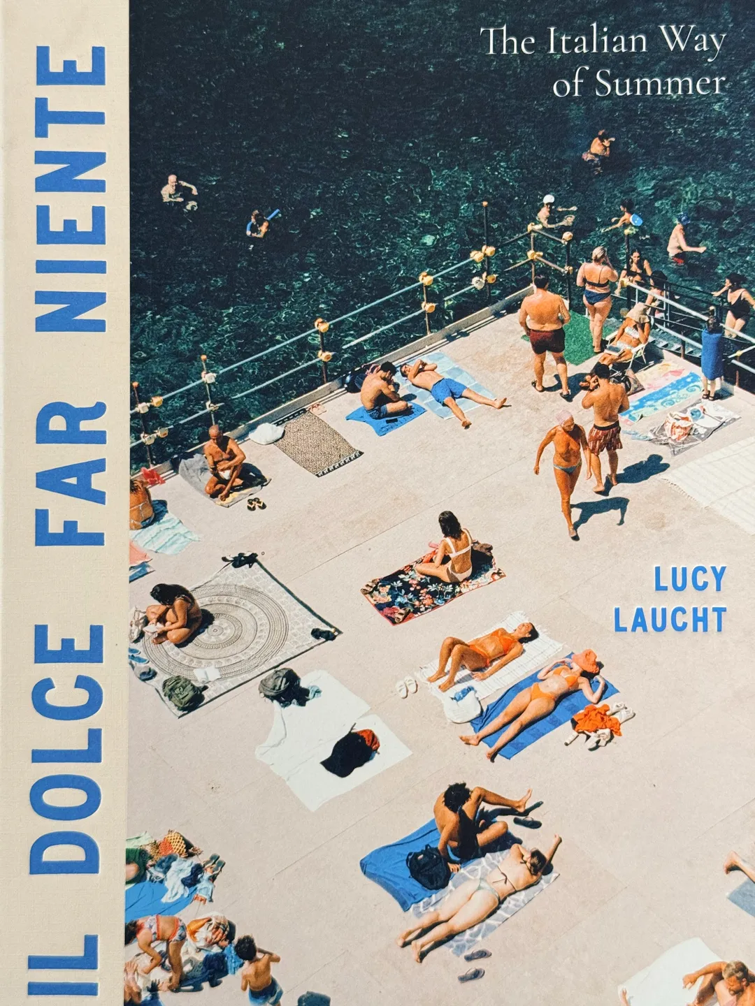 Il Dolce Far Niente: The Italian Way of Summer by Lucy Laucht, cover of sunbathers on a seaside platform