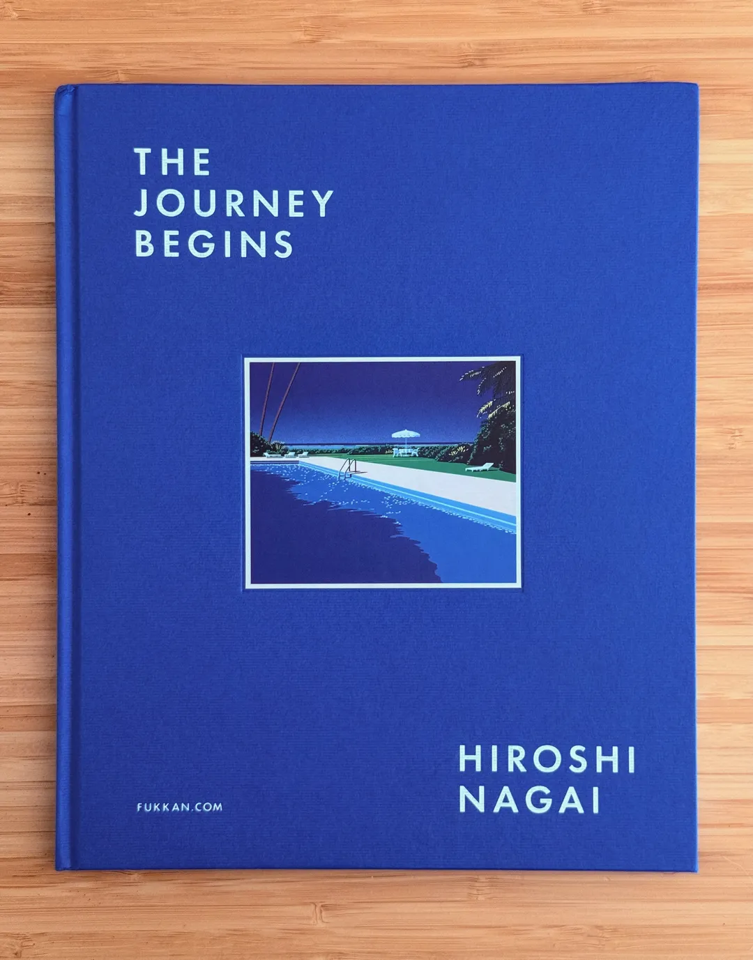 The Journey Begins by Hiroshi Nagai, blue cloth cover with an inset pool painting