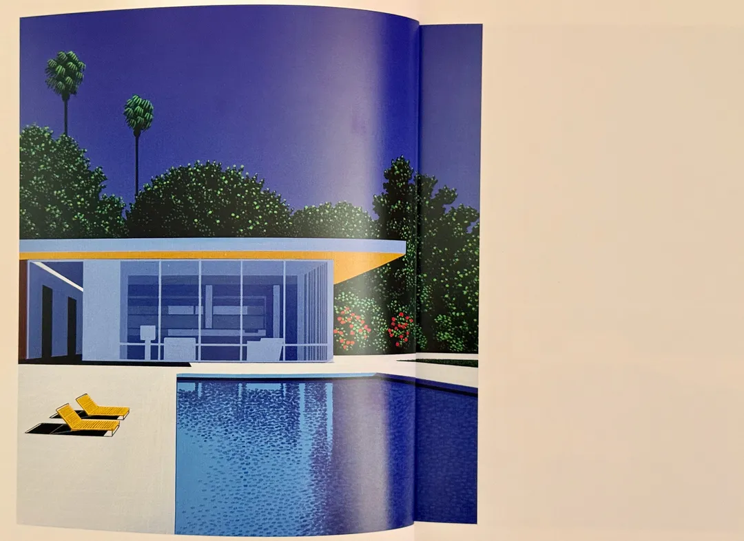 Modernist pool house with yellow loungers under palm trees