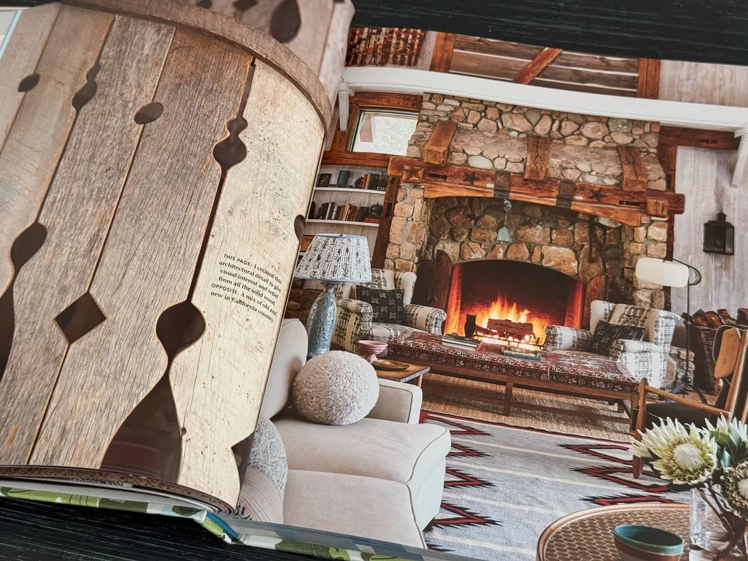 Stone fireplace in a timber-beamed living room