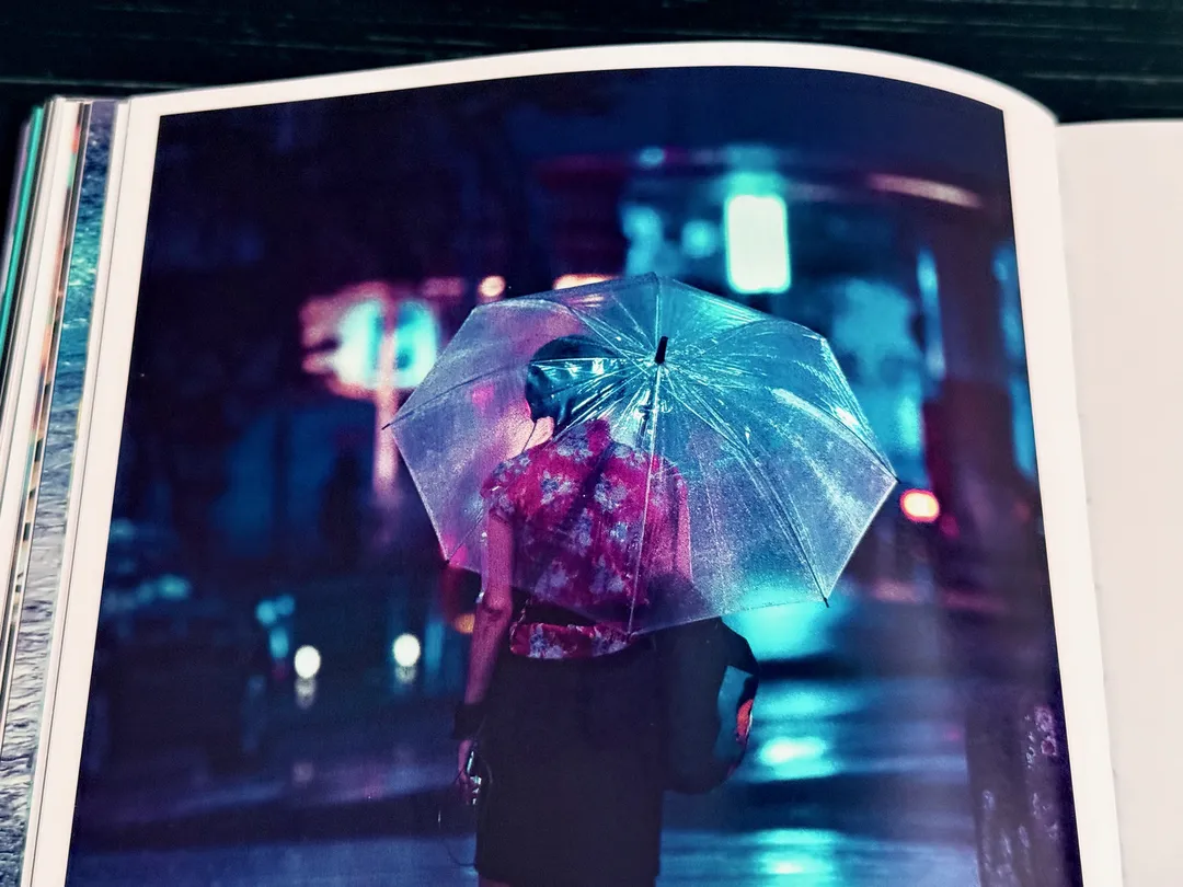 Woman with a clear umbrella on a neon-lit Tokyo street, from TO:KY:OO by Liam Wong